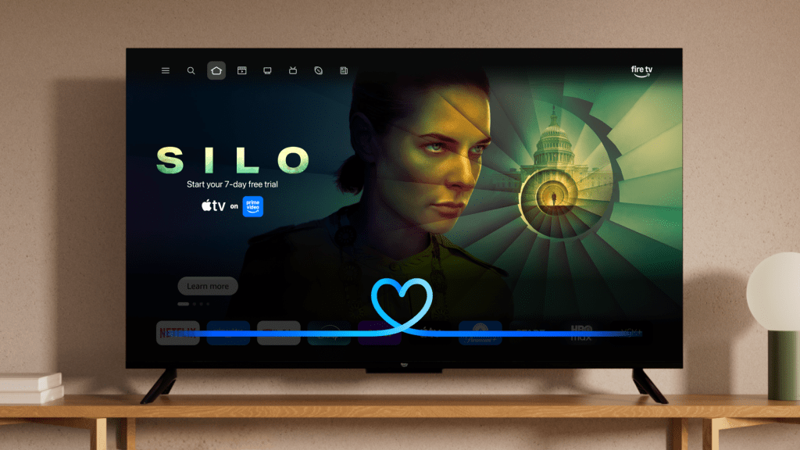 TechCrunch’s coverage image showing the Fire TV interface with Alexa+ integration