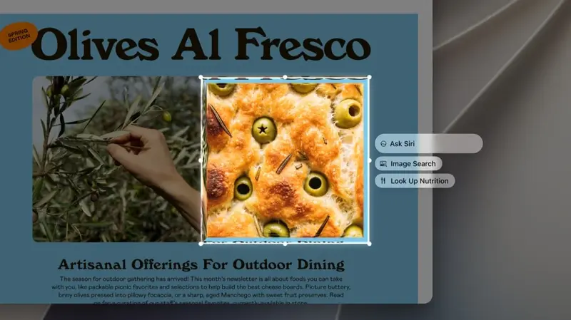 Apple’s official press image showing the new Visual Intelligence experience on a MacBook, with Ask Siri, Image Search, and Look Up Nutrition options appearing over a selected image